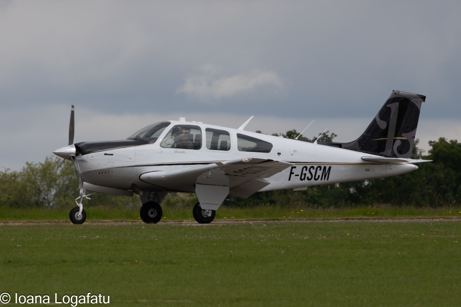 Small aircraft taxiing on a cloudy day